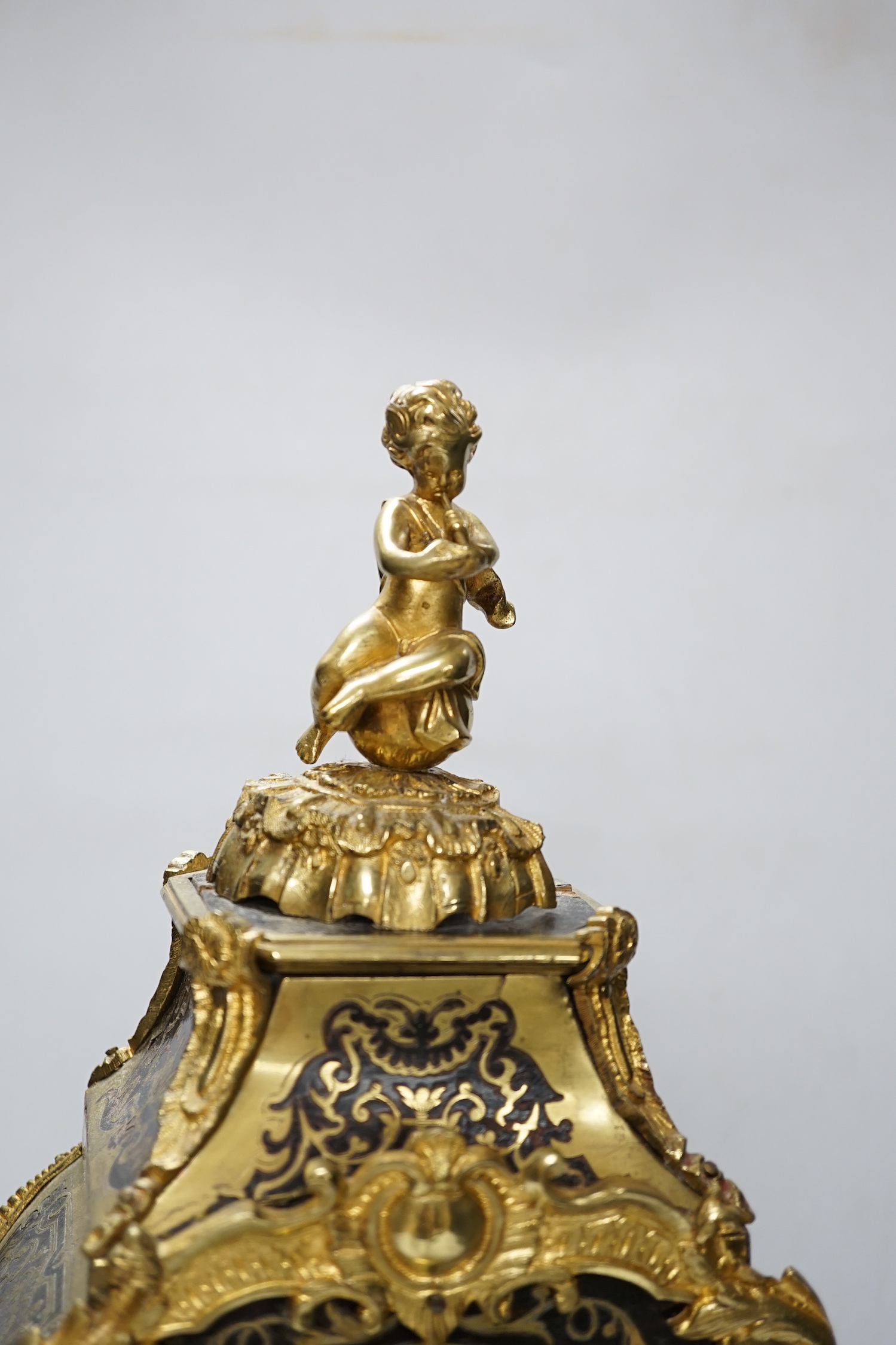 A large Louis XV style cut brass inlaid mantel clock, with a two train, French movement, striking on a bell, 50cm high